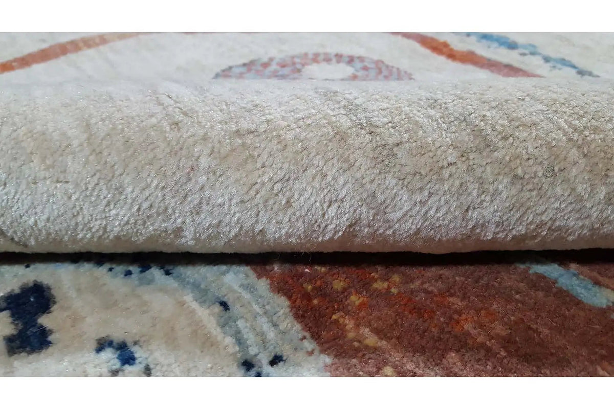 Oriental rug 150x100 cm, close-up of the pile with a beige surface and colored patterned areas