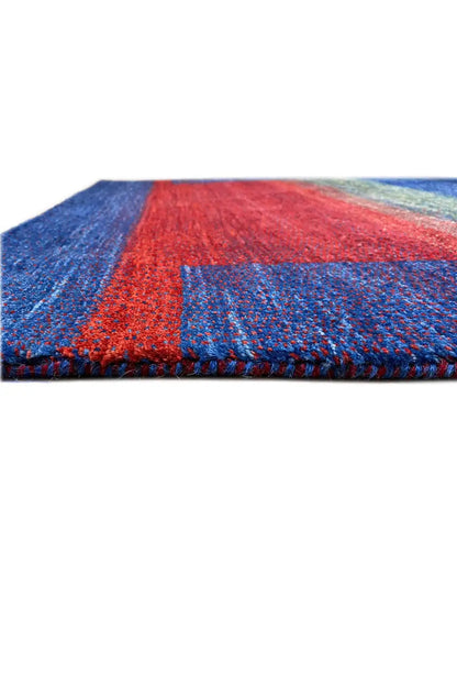 Gabbeh rug (168x105 cm) close-up of the edge: red texture with a blue border