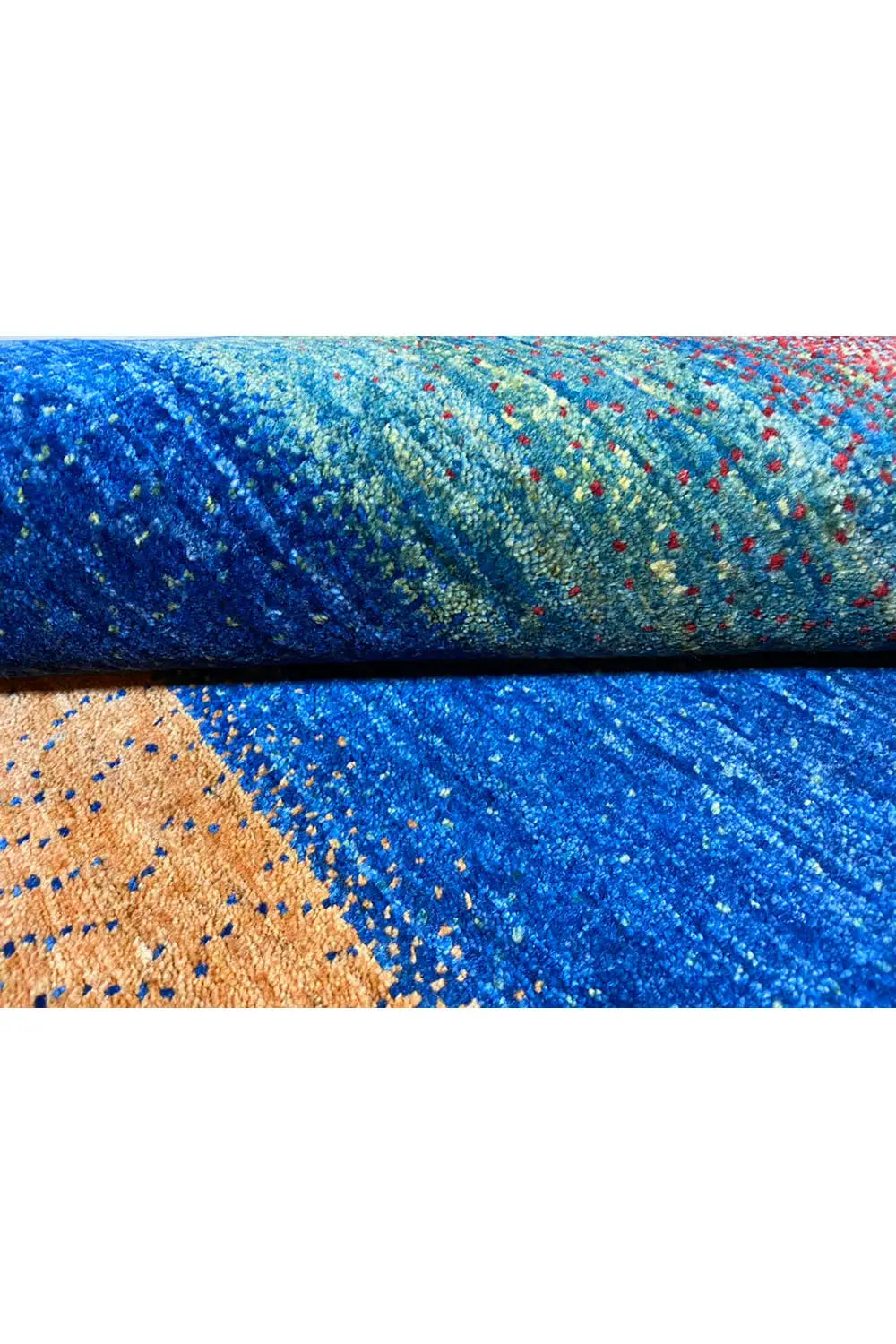 Gabbeh rug (168x105 cm) edge detail: blue pile area and orange triangle
