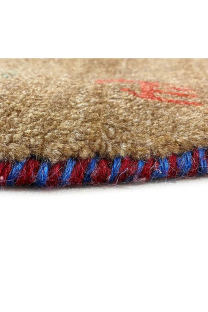 Close-up: Gabbeh rug edge with a colorful fringe band in blue and red