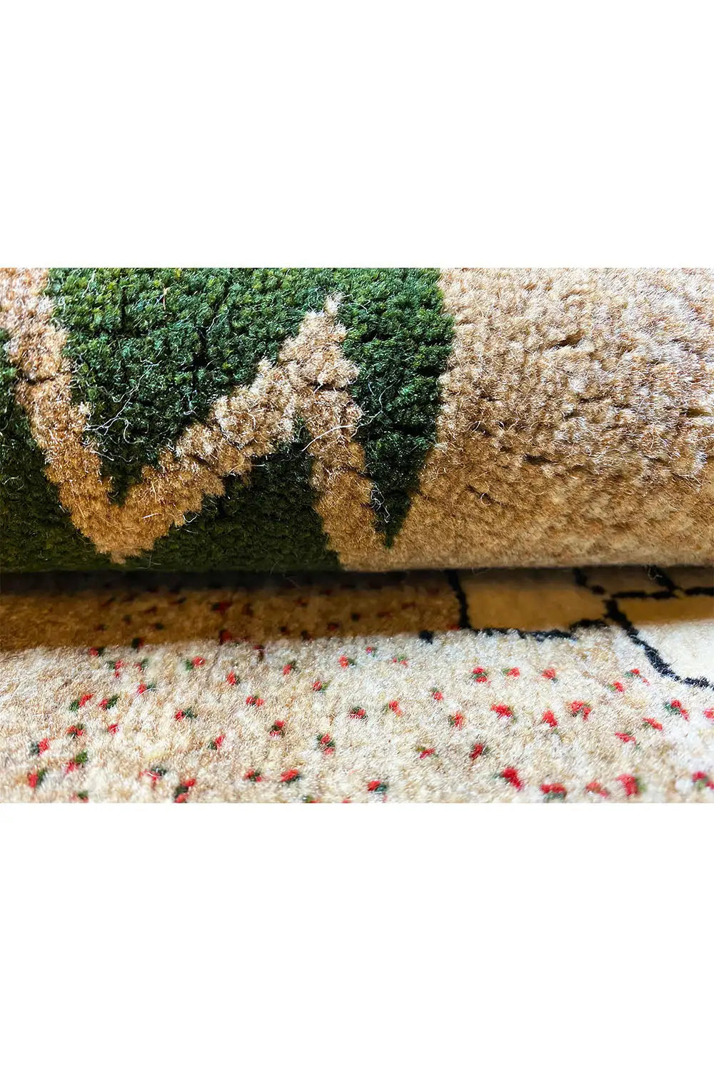 Gabbeh rug with green ornament and multicolored pile, close-up