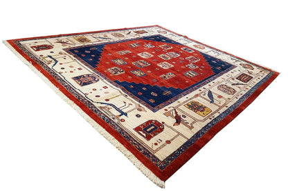 Rectangular rug with a red central field, blue corner area, and multicolored borders