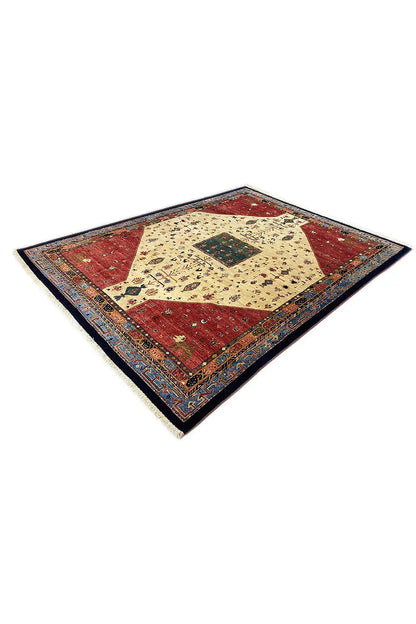 Rug corner with a red outer field, beige pattern, and dark blue border