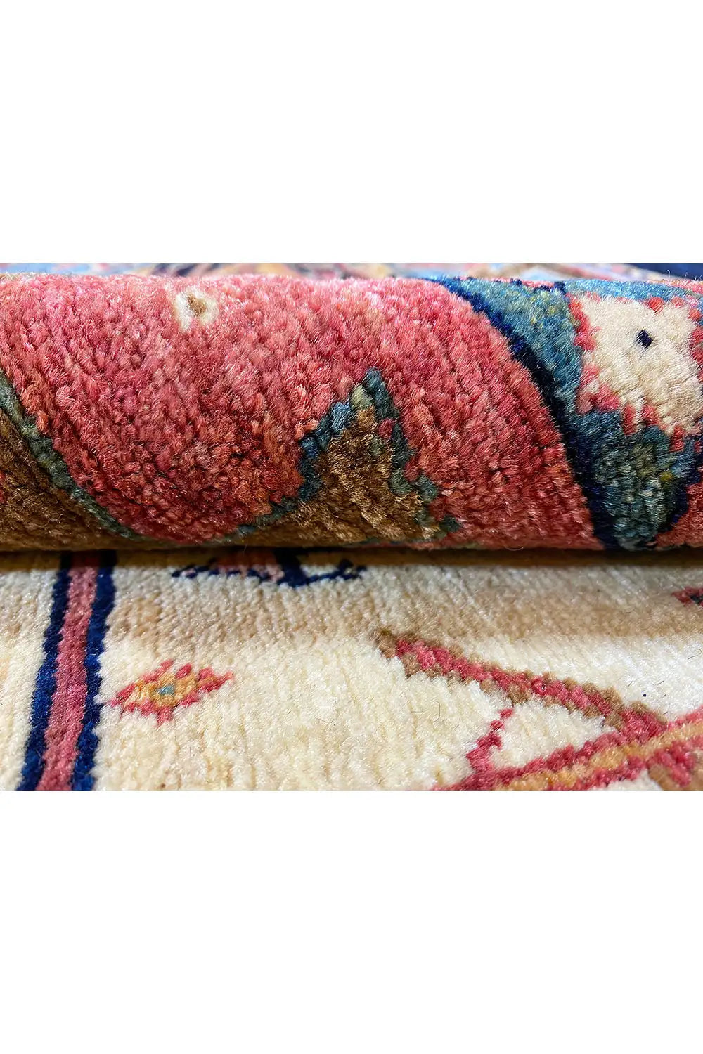 Carpet detail with a colored border and a high-pile red section