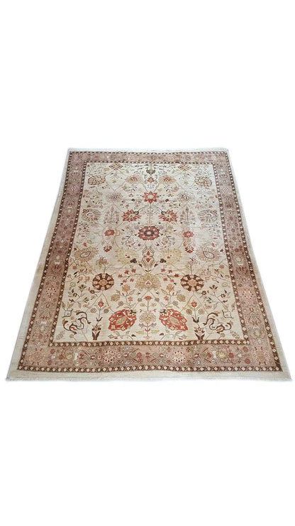 Oriental rug with a beige background, brown border, and floral ornaments