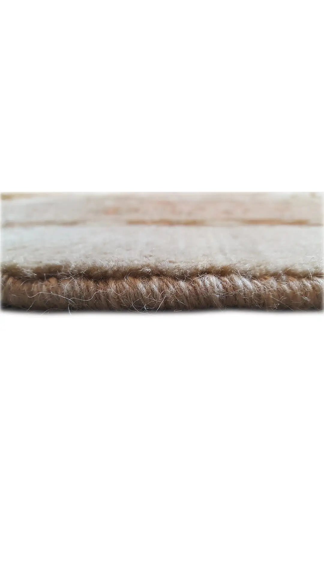Carpet edge with brown pile and a slightly frayed border