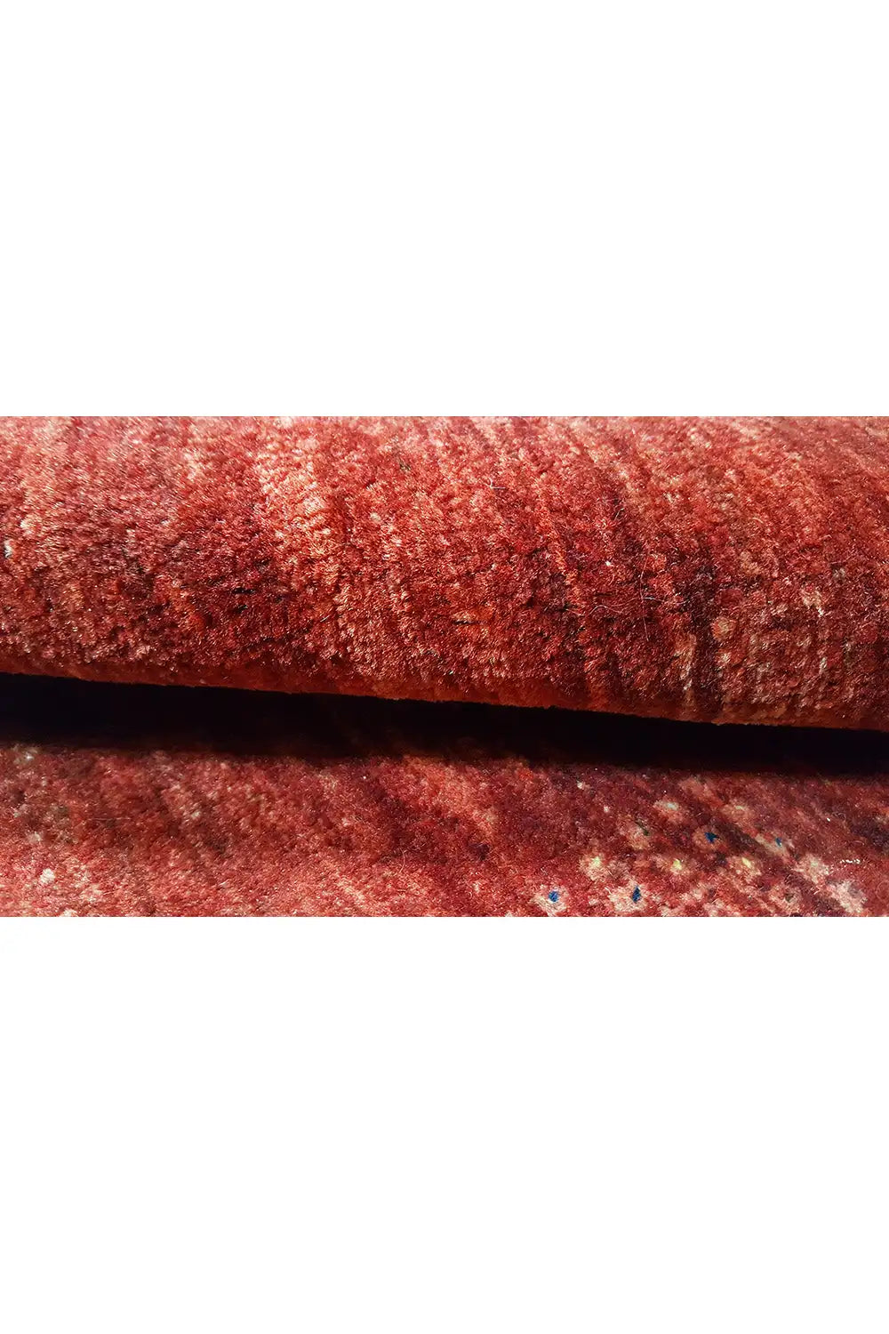 Red gabbeh textile, close-up of the woven surface
