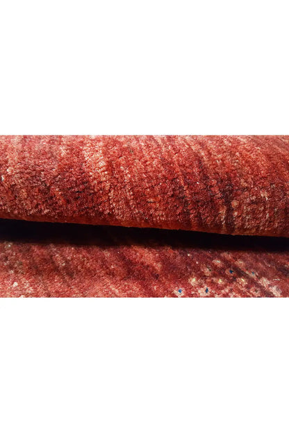 Red gabbeh textile, close-up of the woven surface
