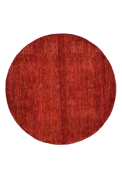 Round “Lori” Gabbeh rug (86x86 cm) in red with a fine woven texture