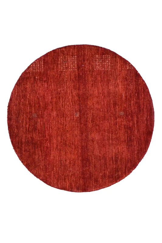 Round “Lori” Gabbeh rug (86x86 cm) in red with a fine woven texture