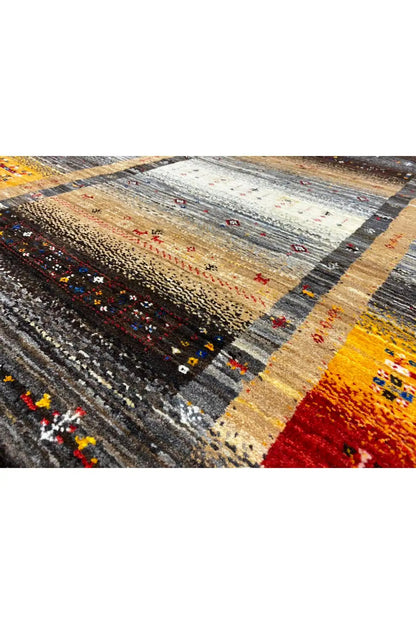 Gabbeh rug 130x83 cm close-up: gray central stripe, red accents and patterns