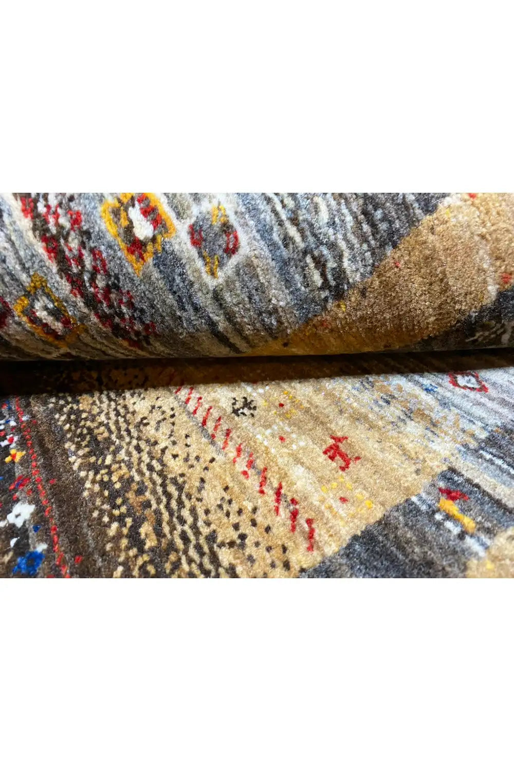 Gabbeh rug 130x83 cm close-up: pile structure and colorful ornamentation in the weave