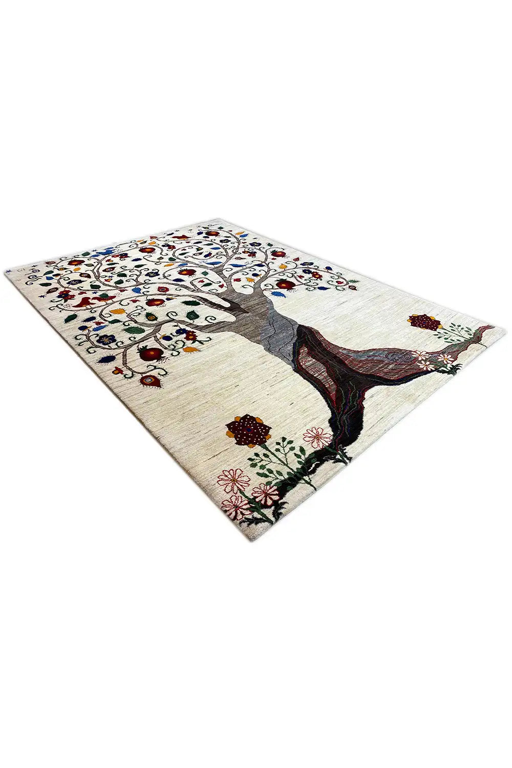 Oriental rug spread out with tree motifs, a dark trunk, and blossoms