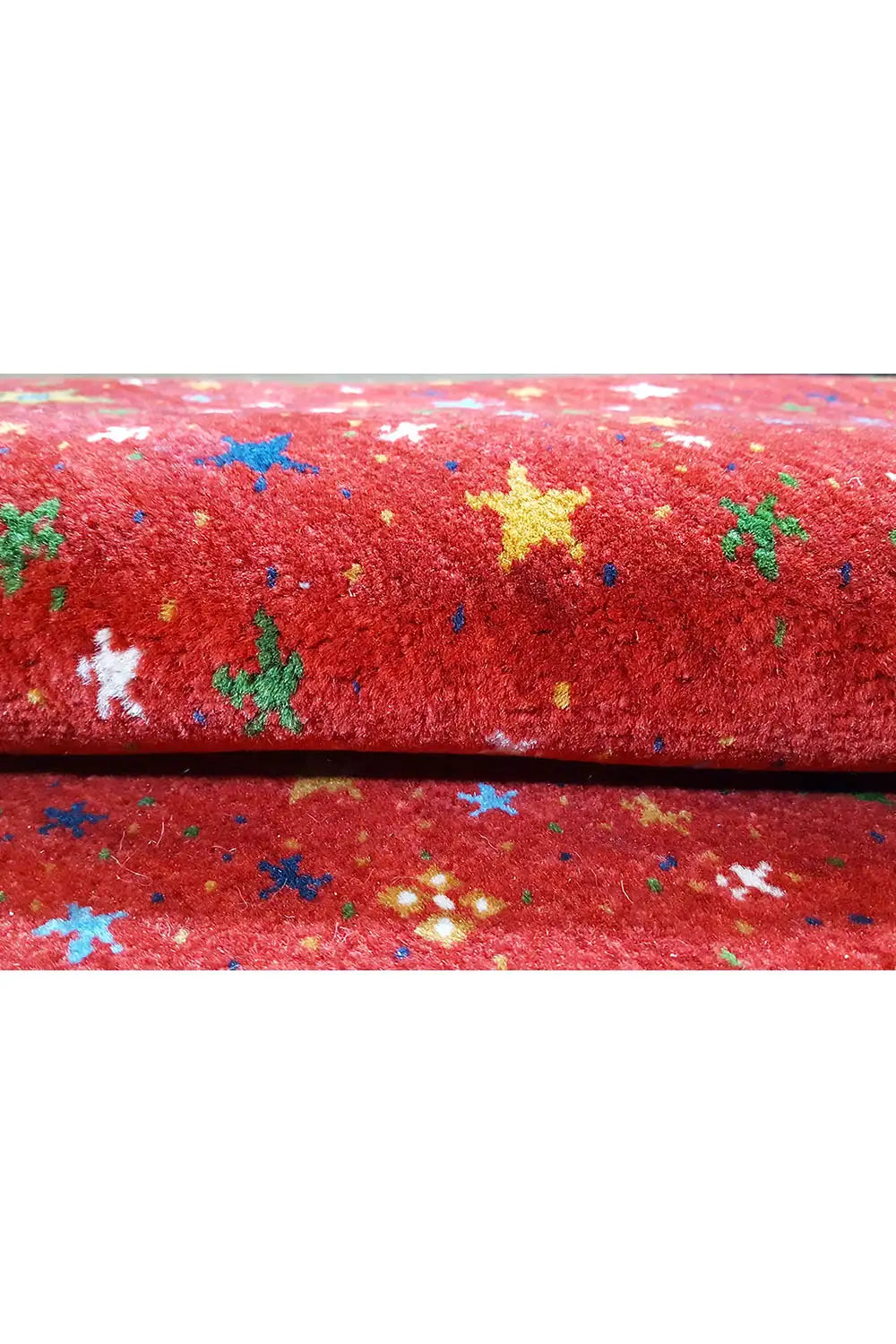 Gabbeh rug “Lori” 246x176 cm, close-up: red pile with colorful stars