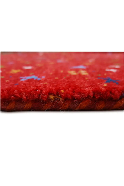 Gabbeh rug “Lori” 246x176 cm, close-up of the rug edge and red pile pattern