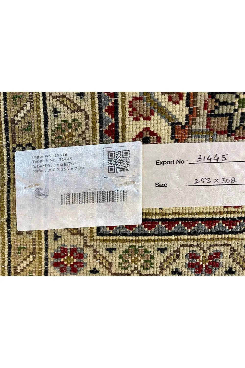 Indo Tabriz rug with sewn-in label and QR code, barcode, and export data