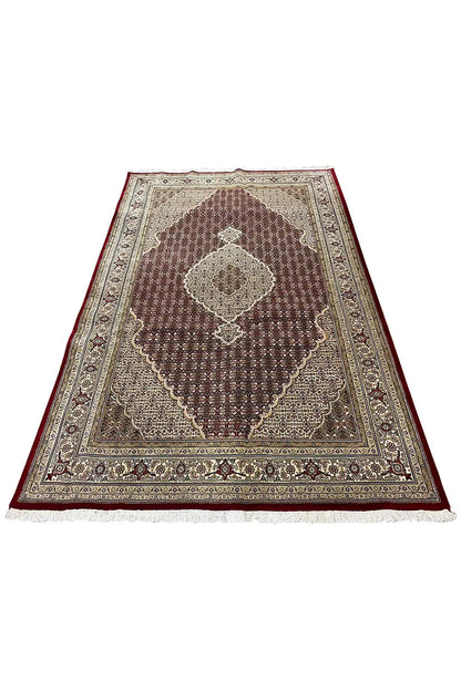 Rug with medallion design, brown-red pattern, beige border, wide edging