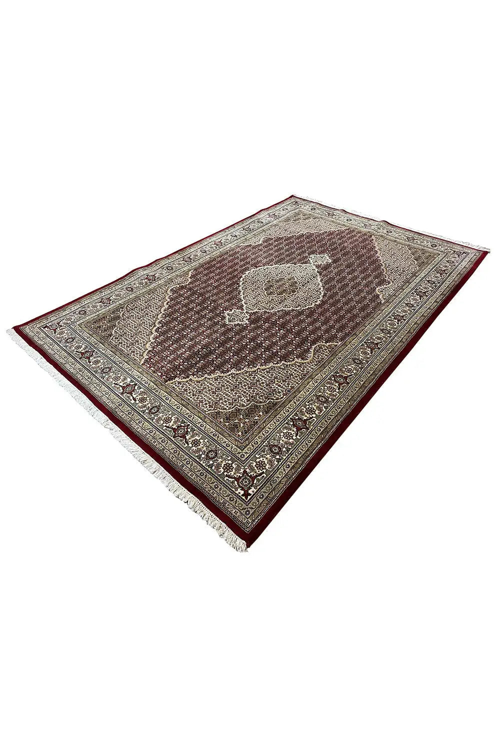 Diamond-shaped rug with a reddish-brown pattern, beige border, and ornaments