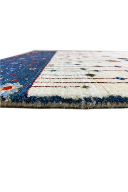Gabbeh rug 123x77 cm Detail of the edges: short fringes and colorful border at the top