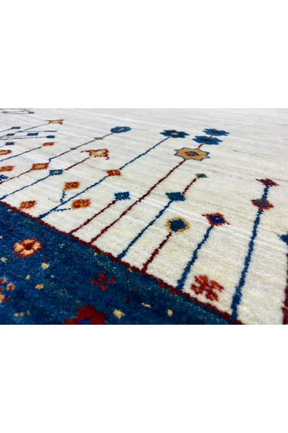 Gabbeh rug 123x77 cm close-up of the pattern: vine lines in blue, red, and gold tones