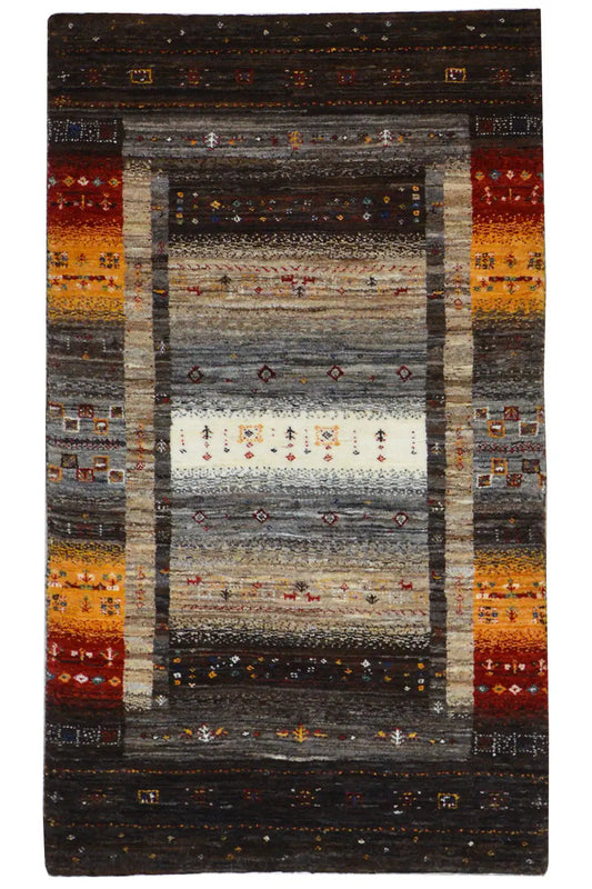 Rug with a geometric pattern in dark brown and warm red/yellow tones, rectangular