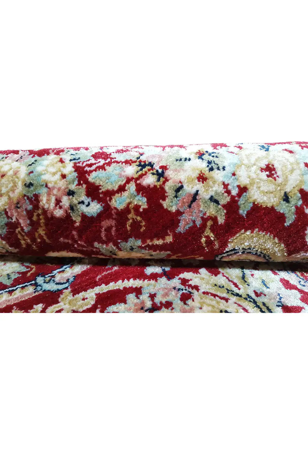 Carpet surface in detail: colorful ornamental design with red pile and bound edge