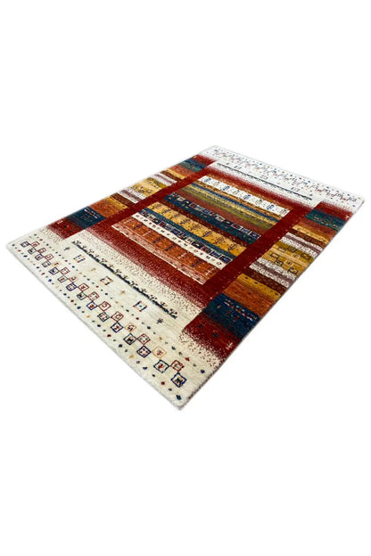 Gabbeh rug (140x97 cm), angled: rectangular fields in brown, blue, and cream
