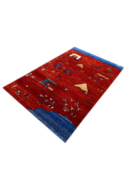 Gabbeh rug in a twisted view: red background, blue border, small colorful ornaments
