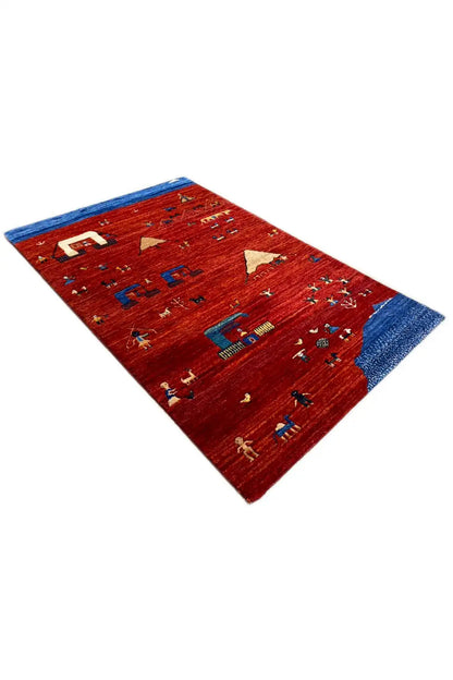 Gabbeh rug, red background with a blue border, decorative symbols in small rows