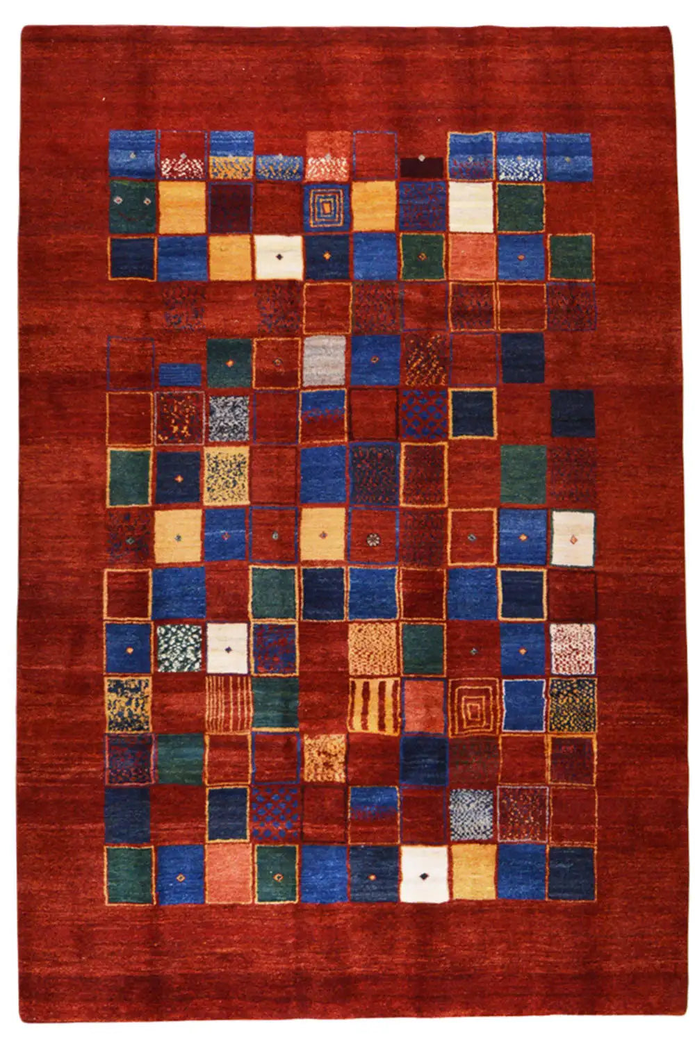 Gabbeh rug with a square patchwork pattern in shades of red, blue, and green