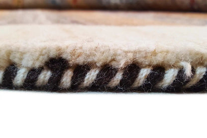 Gabbeh rug: framed border with tassels and black-and-beige yarns