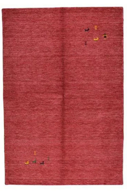 Red Gabbeh rug with a central seam and small animal motifs in yellow and green