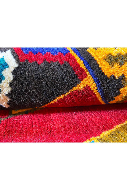 Carpet in detail: colorful border patterns, bound edges, short pile fibers
