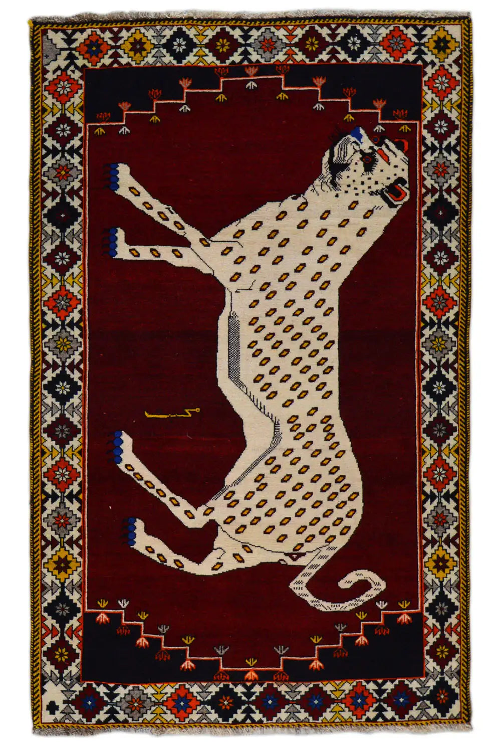 Gabbeh rug with a large animal motif in beige on dark red, surrounded by an ornamental border