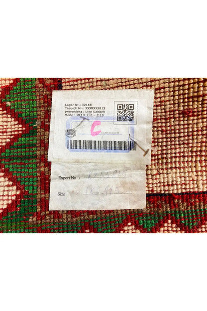 Gabbeh rug with a woven-in label, QR code/barcode print on a colorful background