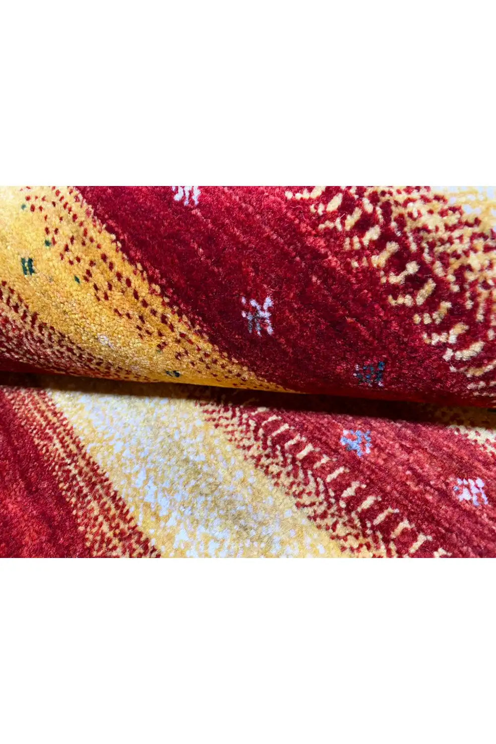 Gabbeh rug 149x99 cm close-up: woven texture in red, yellow, and beige