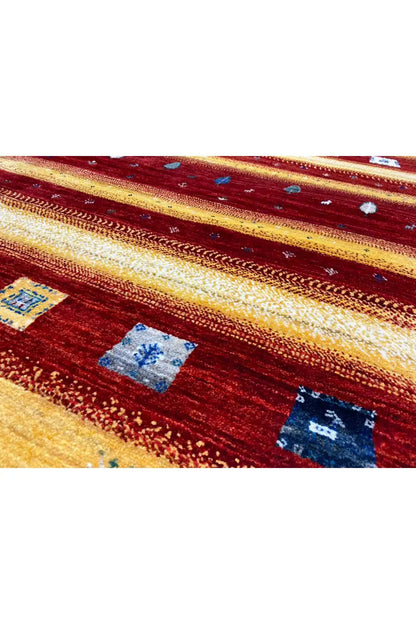 Gabbeh rug 149x99 cm close-up: geometric fields and splashes of red/yellow