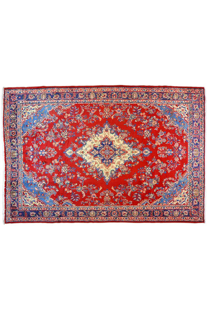 Rectangular rug with a red background and a blue-and-red ornamental pattern