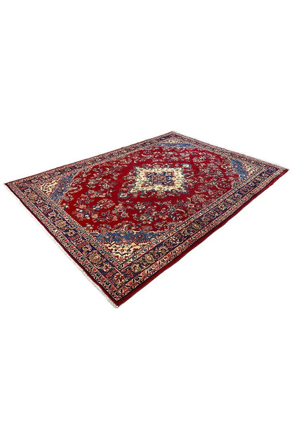 Red carpet with medallion and blue border, viewed diagonally