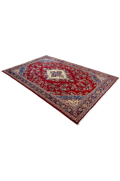 Red patterned oriental rug with a blue border and central ornamental field