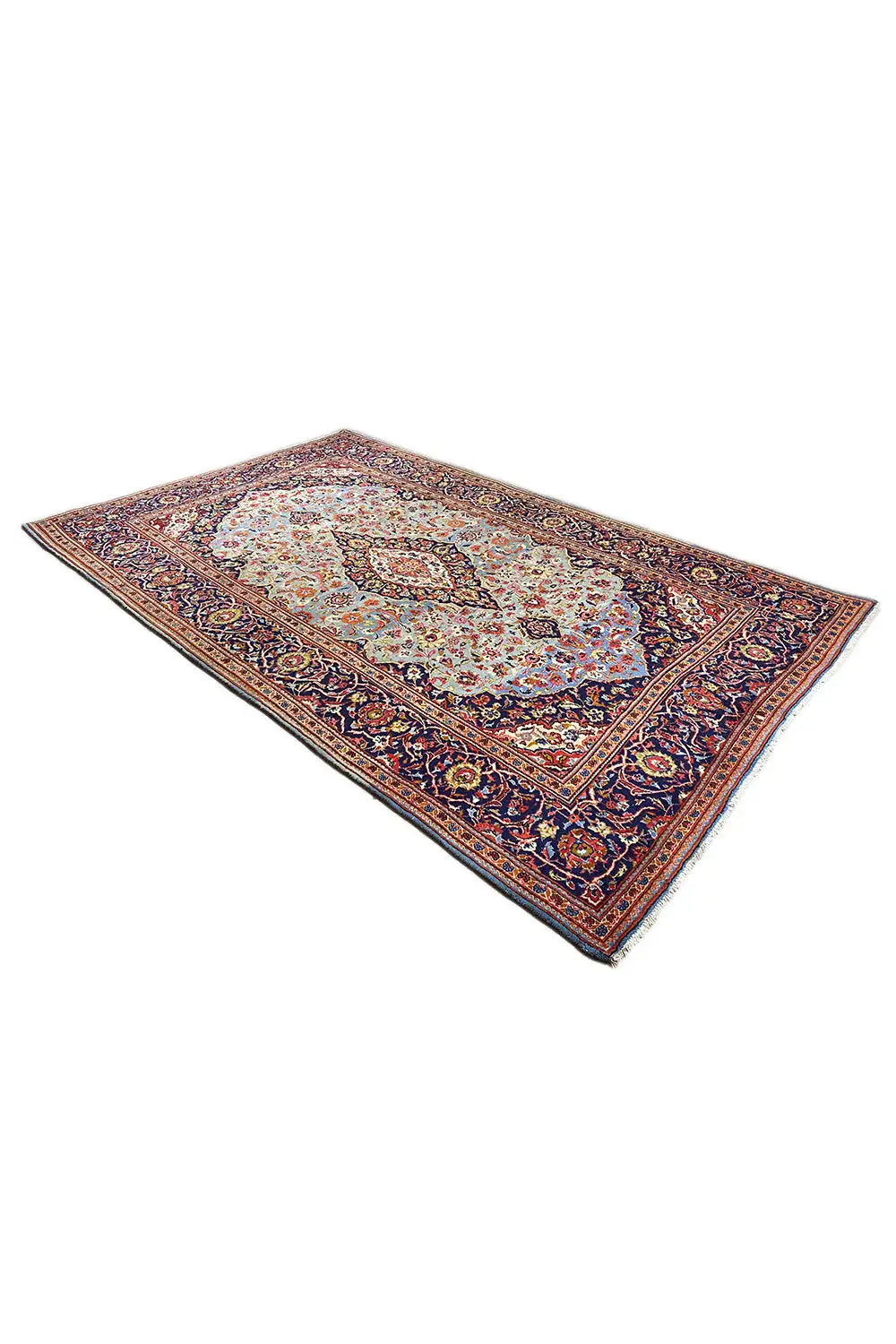 Rug viewed from above at an angle, Oriental pattern with a border in blue, red, and cream