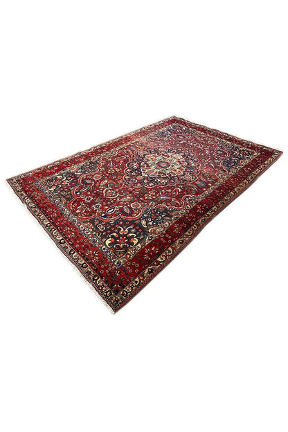 Carpet with a red ground and ornamental medallion, diagonal view, 316x216 cm
