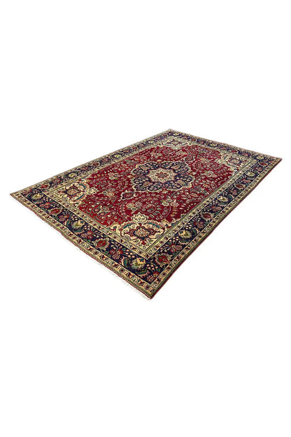 Tabriz rug in diamond view, red floral pattern with blue-and-gold border