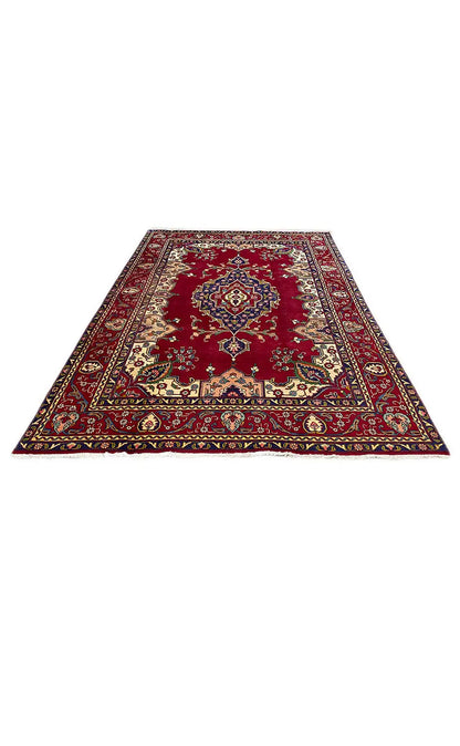 Red Oriental rug, rectangular, with a medallion design and multicolored border pattern