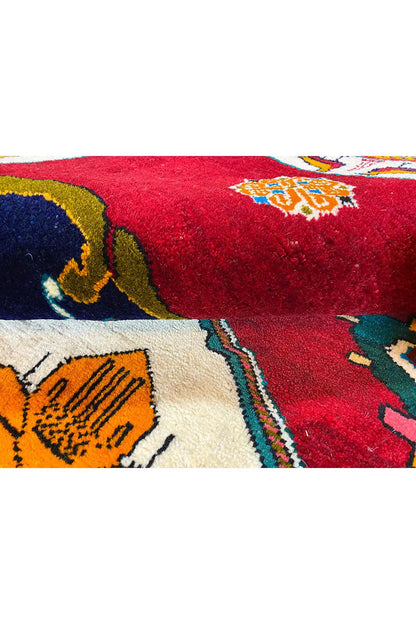 Close-up: red carpet with a blue ornament and patterned color fields
