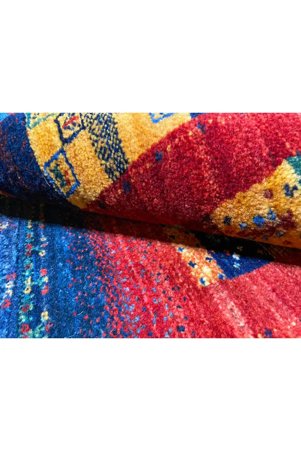 Gabbeh rug 122x79 cm detail view: pile with colorful ornamental segments