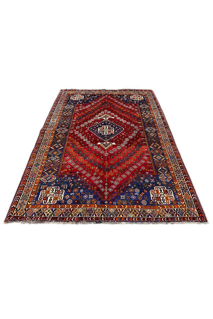 Rectangular rug with a red pattern and blue accents, flat-woven.