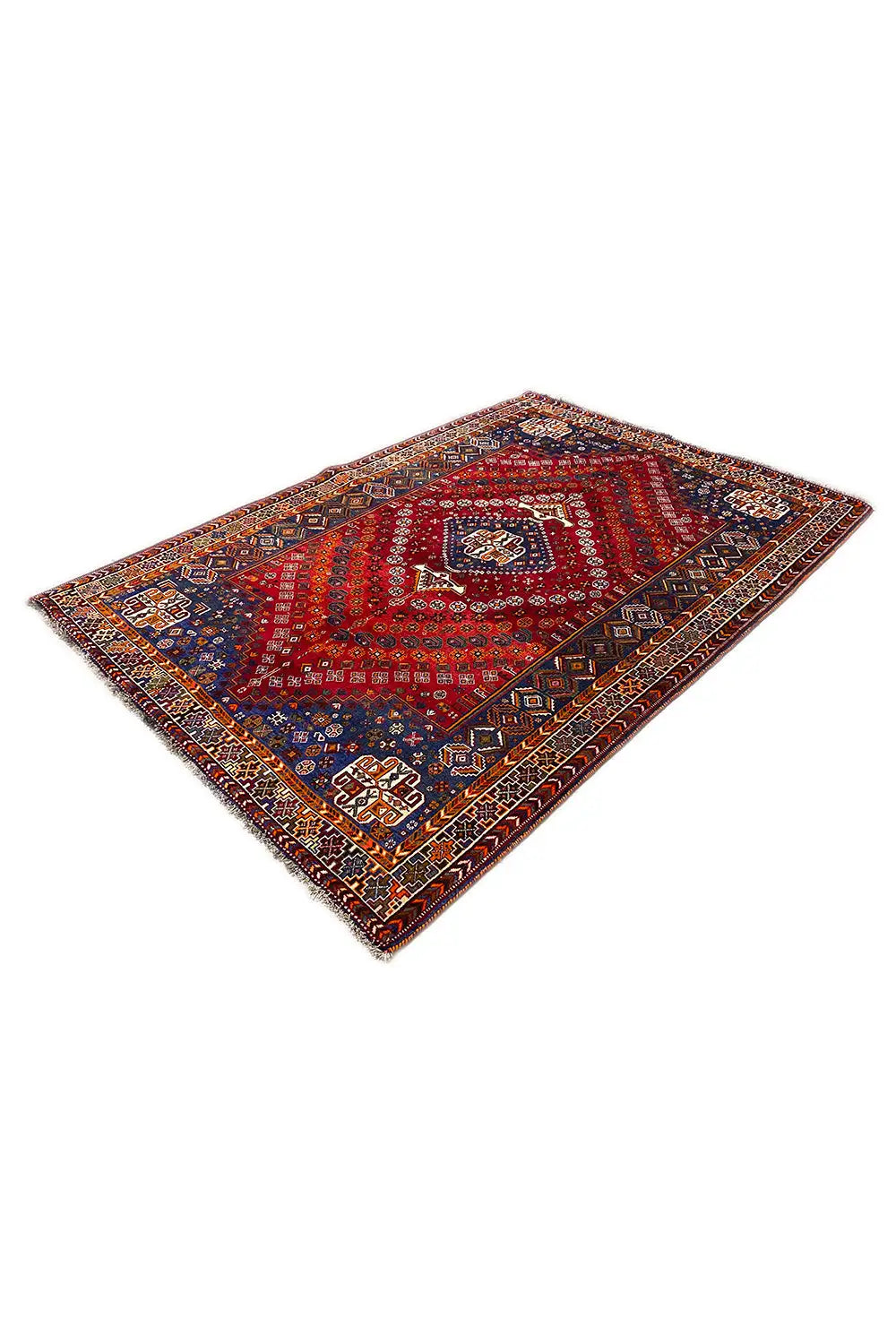 Carpet with a red geometric ornament pattern, edged in blue, diagonal view.