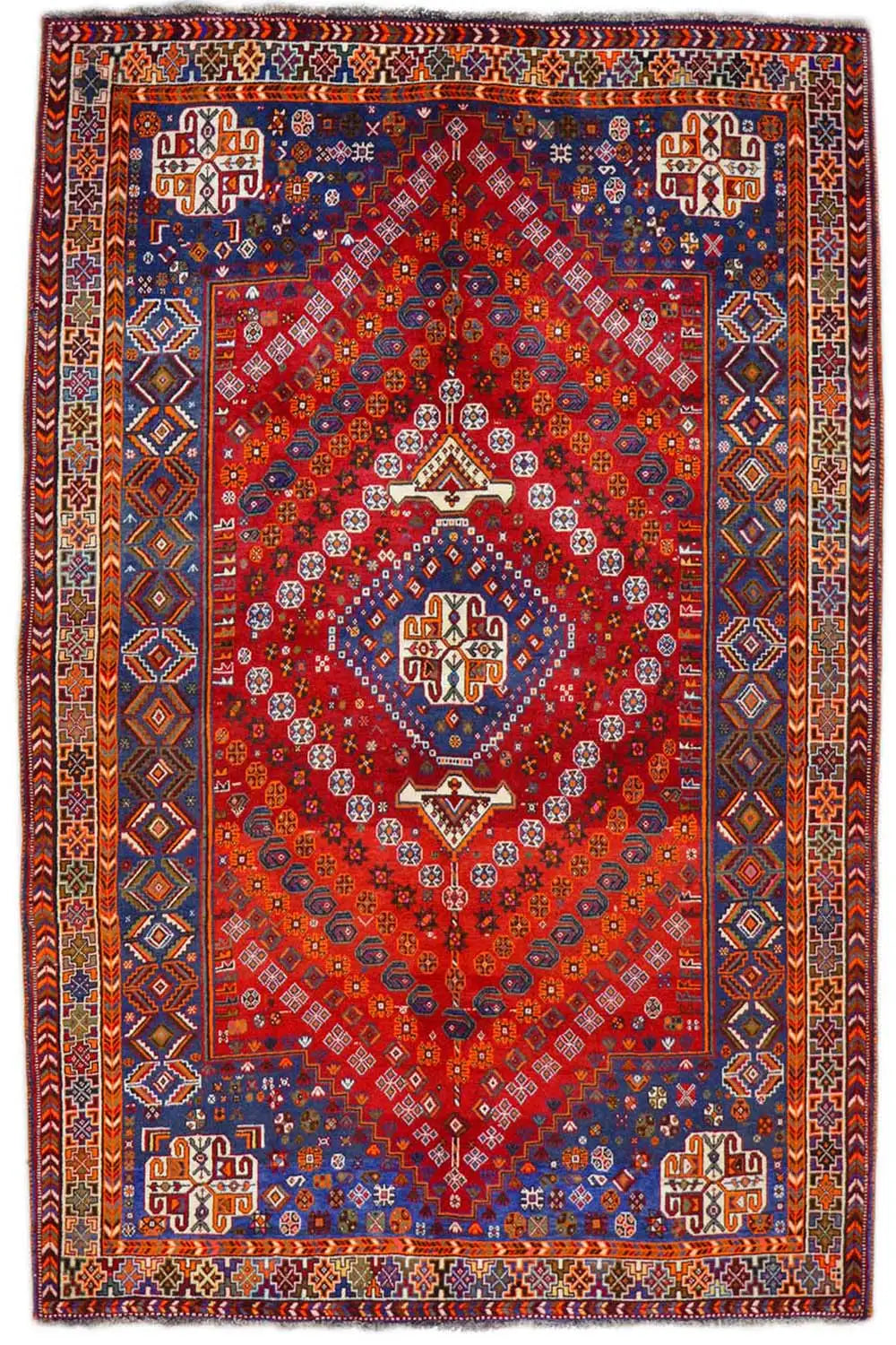 Rectangular carpet with a red background and blue-red ornamental pattern, with a border.