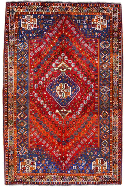 Rectangular carpet with a red background and blue-red ornamental pattern, with a border.